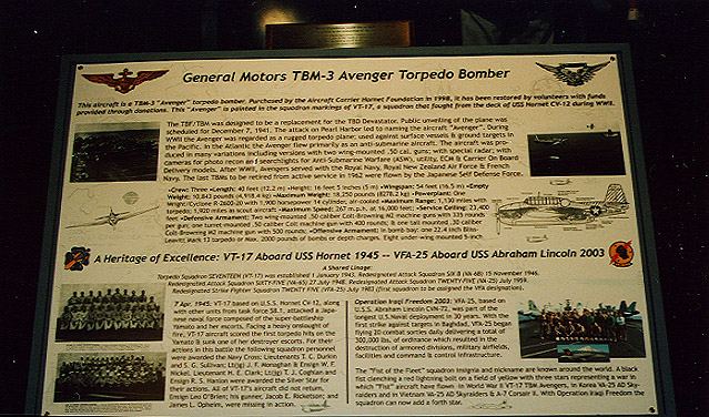 TBM Placard.jpg - The Grumman TBF (TBM designate for planes manufactured by Eastern Aircraft a division of General Motors) was a torpedo bomber built for the U.S. Mavy and Marine Corps. The TBD Douglas Devastator torpedo bomber introduced in 1935 was obsolete by 1939 and last saw action in the Battle of Midway. The Avenger, Grumman's first torpedo plane, was the heaviest single-engine aircraft of WWII and it featured Grumman's new wing fold mechanism to maximize storage space on a carrier. The Wildcat and Hellcat received similiar folding wings.